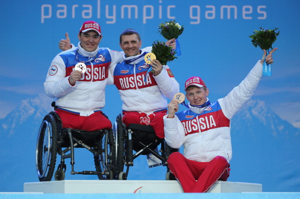 From left, silver medallist Irek Zaripov, gold medallist Roman Petushkov and bronze medallist Aleksandr Davidovich celebrate their Russian 1-2-3 ©Getty Images