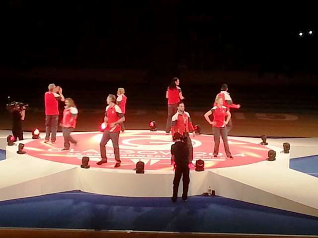 Glasgow 2014 Games Time workforce take to the stage in the Emirates Arena to model the new uniform ©ITG