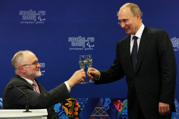 IPC President Sir Philip Craven shares a toast with Russian president Vladimir Putin ©Getty Images