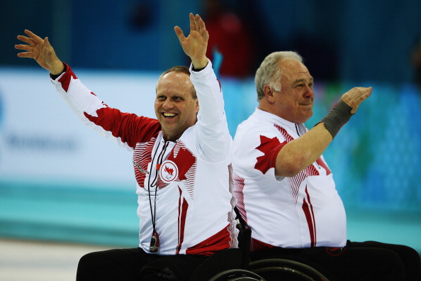 Jim Armstrong and Dennis Thiessen celebrate after winning the gold medal ©Getty Images