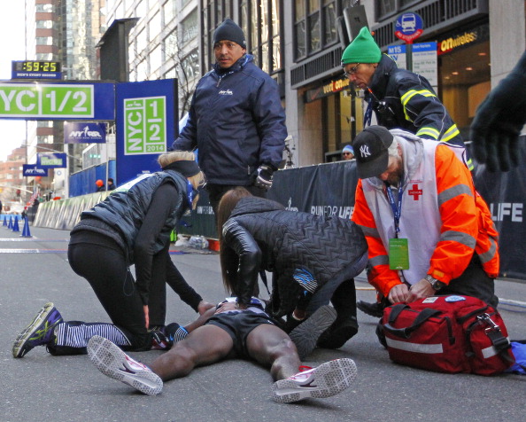 Mo Farah collapses just seconds after crossing the finish line in second at the New York City Half Marathon ©Getty Images
