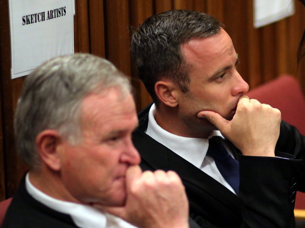 Oscar Pistorius and his lawyer Barry Roux listen to proceedings in court on day 12 of the murder trial ©AFP/Getty Images