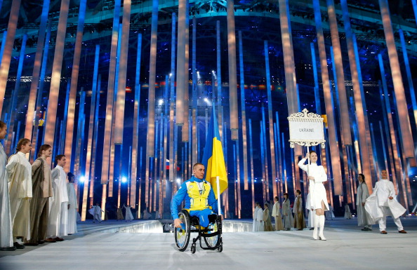 This is the moment Ukraine's flagbearer Mykailo Tkachenko entered the stadium on his own ©Getty Images