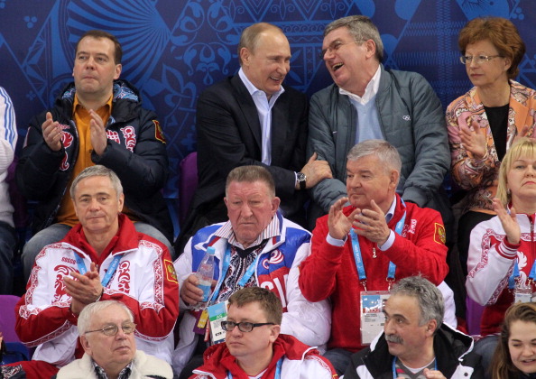 Russian President Vladimir Putin, seen here enjoying a joke with International Olympic Committee President Thomas Bach, was not laughing later as his hockey curse struck again ©Getty Images