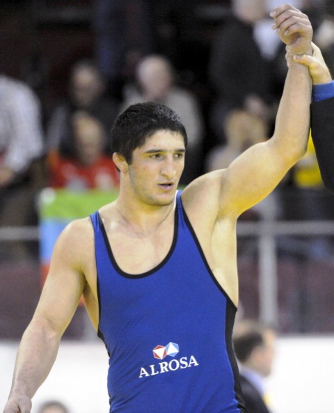 Abdulrashid Sadulaev of Russia raises his arm after claiming his maiden European title in Vantaa today ©AFP/Getty Images
