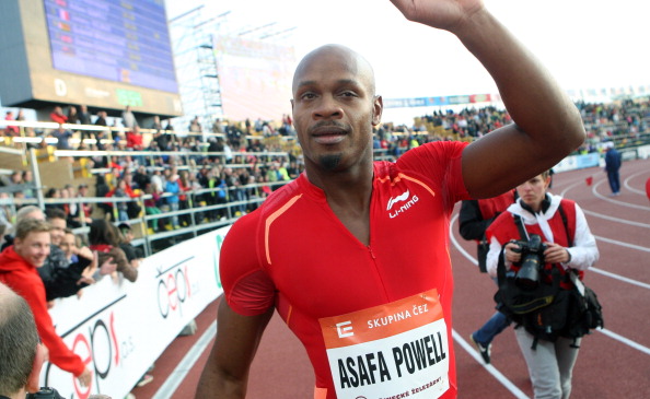 Asafa Powell celebrating a race win shortly before being banned from the sport last summer ©Getty Images
