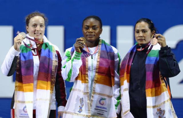 Devi (right) won weightlifting bronze at Delhi 2010 ©Getty Images