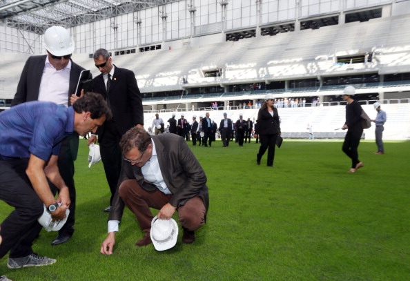 Even the grass at the Arena da Baixada in Curitiba was inspected by Jérôme Valcke as he toured the venue ©AFP/Getty Images