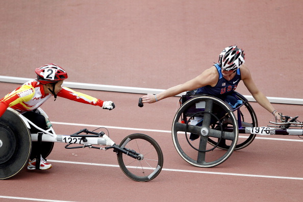 London 2012 Paralympic champion Wenjun Liu (left) eased to victory against compatriot Hongjiao Dong in the women's 100m T54, one of the most eagerly anticipated races of the day in Beijing ©Getty Images