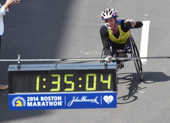 Tatyana McFadden punched the air as she crossed the finish line at the Boston Marathon ©AFP/Getty Images