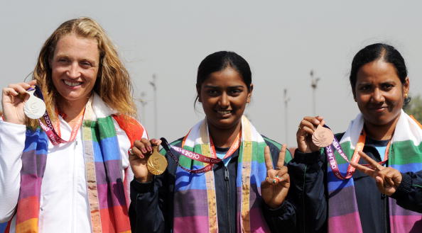 Alison Williamson with her individual silver medal from the 2010 Delhi Games alongside Inidia's gold medallist Deepika Kumar (centre) and bronze medallist Dola Banerjee ©AFP/Getty Images