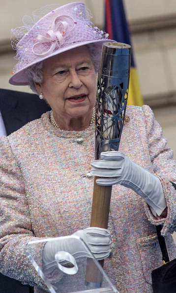 The Queen pictured with the Baton for the Glasgow 2014 Games at the launch of the Queen's Baton Relay in London in October last year ©Getty Images