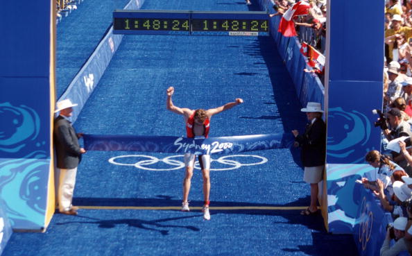 Canada's Simon Whitfield is surprise winner of the first men's Olympic triathlon title at the Sydney 2000 Games ©Bongarts/Getty Images