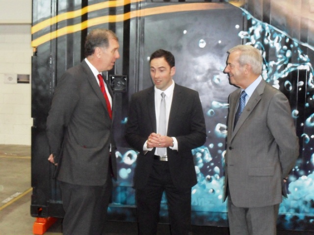 Aggreko interim chief executive Angus Cockburn (left) explains to David Murdoch (centre) and Lord Smith of Kelvin the process behind the power in Dumbarton ©ITG