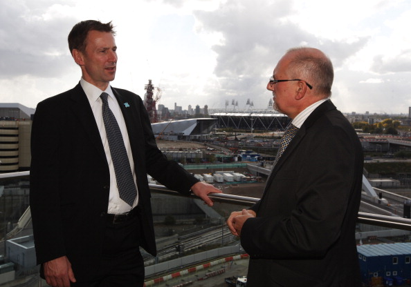 Dennis Hone, pictured with culture secretary Jeremy Hunt inspecting Games venues in 2011, has stepped down to take up a new role ©Getty Images