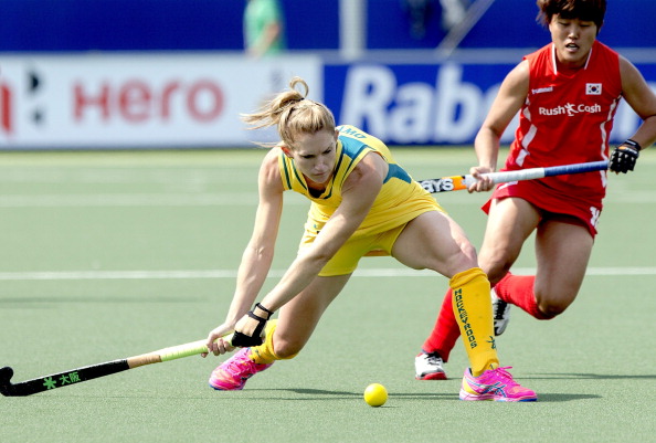 Australia's Kirstin Dyer in action, with Korea's Mihyun Park in attendance, during the side's match on the opening day of the Rabobank Hockey World Cup in The Hague. Australia won 3-2. ©Getty Images
