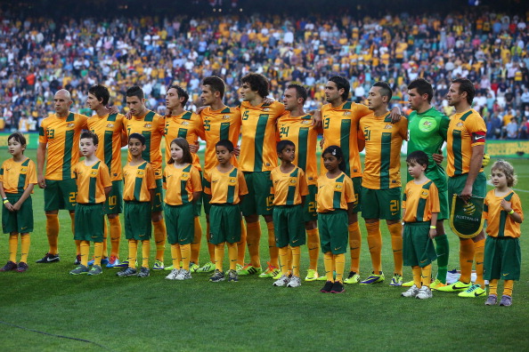 Australia's Socceroos line up before last November's friendly against Costa Rica. At this point, none of them knew the awful slogan they were doomed to carry around Brazil ©Getty Images