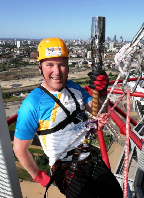 Four-time Olympic rowing champion Matthew Pinsent abseiled down the ArcelorMittal Orbit with the Glasgow 2014 Queen's Baton ©Getty Images