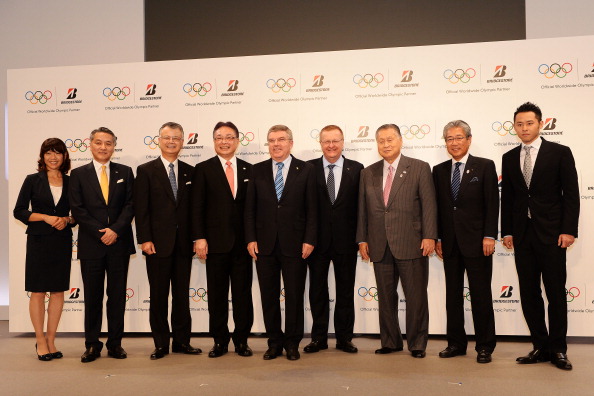 IOC President Thomas Bach (centre) with vice-president John Coates and members of Bridgestone, Tokyo 2020 and the Japanese Olympic Committee at a news conference in Tokyo ©Getty Images