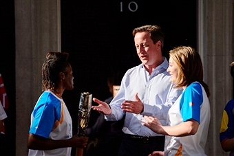 Olympic champion Nicola Adams carried the Queen's Baton into Downing Street where it was welcomed by British Prime Minister David Cameron ©AFP/Getty Images