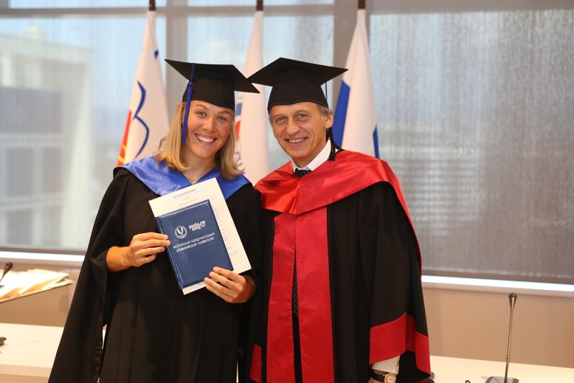 Olympic silver medallist Molly Engstrom recieves her MSA qualification from RIOU Rector Professor Lev Belousov ©RIOU