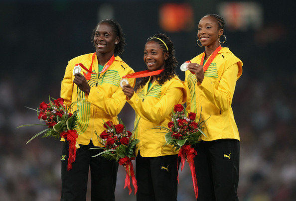 Sherone Simpson (left), celebrating her Olympic 100 metres silver medal at Beijing 2008, has had her drugs ban temporarily lifted by the Court of Arbitration for Sport ©Getty Images