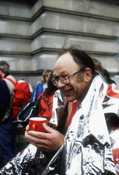 Chris Brasher, co-founder of the London Marathon, cradles a cup that cheers after running the first London race in 1981 ©Hulton Archive/Getty Images