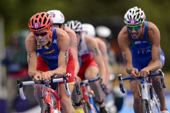 Italy's Alessandro Fabian, pictured right chasing Javier Gomez in the London 2012 Games, helped Italy earn the European Mixed Relay Team title in Kitzbuhel today ©AFP/Getty Images