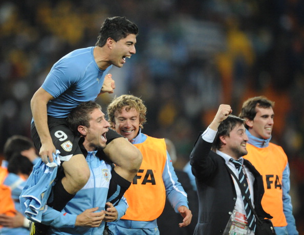 Luis Suarez is chaired off the pitch by his Uruguayan team mates after his deliberate handball denied Ghana what might have been a last-minute winner in the 2010 World Cup final quarter-final. Despite being sent off, Suarez saw his team win on penalties after extra-time ©AFP/Getty Images