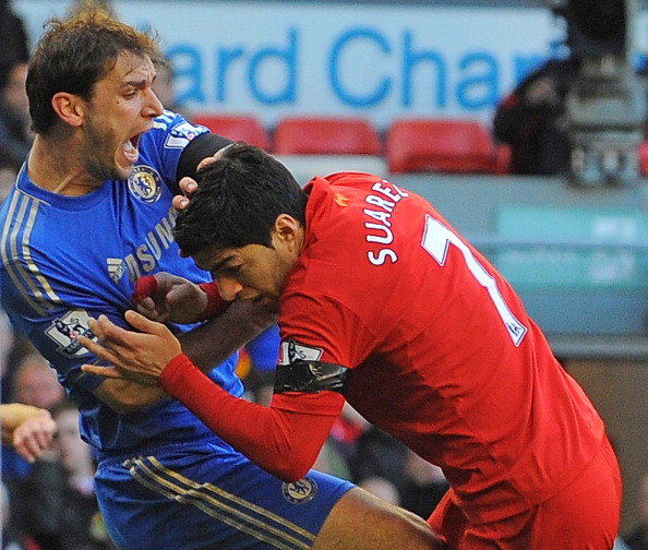 Chelsea's Branislav Ivanovic reacts after being bitten on the arm by Luis Suarez during a match last season, following which the Liverpool forward received a ten-match ban from the English Football Association ©AFP/ Getty Images