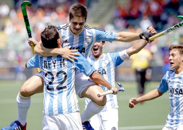 Gonzalo Peillat (centre) celebrates one of his hat-trick of goals in Argentina's 3-1 win over New Zealand today at the Rabobank Hockey World Cup in The Hague ©AFP/Getty Images