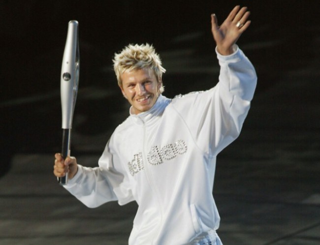 David Beckham carried the Queen's Baton Relay into the City of Manchester Stadium at the 2002 Commonwealth Games ©AFP/Getty Images