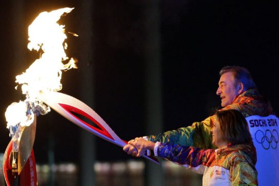 Vladislav Tretiak lit the Olympic Flame, along with ice skater Irina Rodnina, at Sochi 2014 ©Getty Images