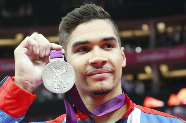Louis Smith, seen showing off his London 2012 silver in the Pommel Horse, will make his international return at the Glasgow 2014 Games after takiing a year off ©AFP/Getty Images