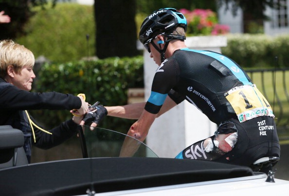 Defending champion Chris Froome gets patched up after suffering a fall early in stage four today ©Getty Images 