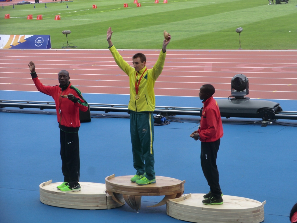 Australia's Michael Shelley lifts his marathon gold inside Hampden Park 