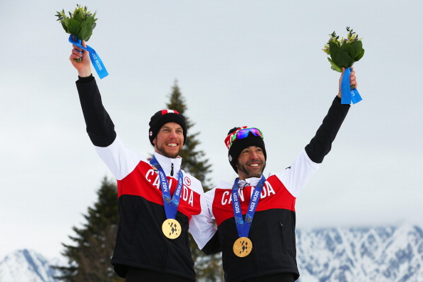 Brian McKeever, pictured with guide Erik Carleton, during Sochi 2014 has no plans to hang up his skis ©Getty Images