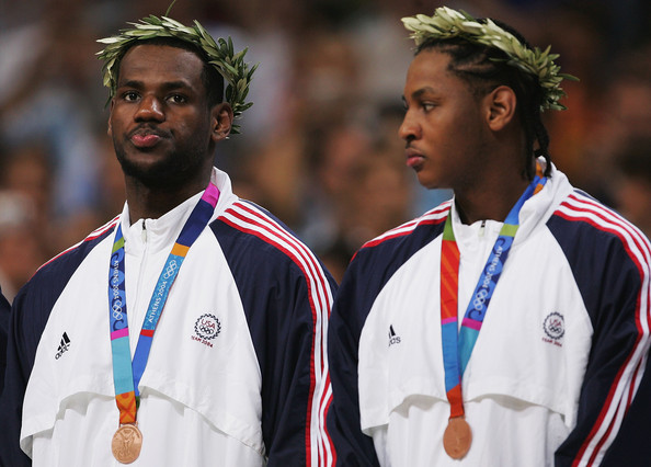 Carmelo Anthony (right), with the Olympic bronze medal from Athens 2004, he gave away to a family member, and which has now been sold for more than $14,000 at auction in California ©Getty Images