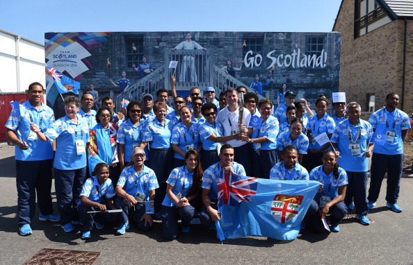 Fijian athletes with the Queen's Baton Relay ©Getty Images