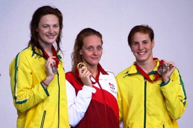 Francesca Halsall shows off her gold medal as she is flanked by Cate (left) and Bronte Campbell who became the first sisters in Commonwealth Games history to medal in the same individual swimming event ©Getty Images 