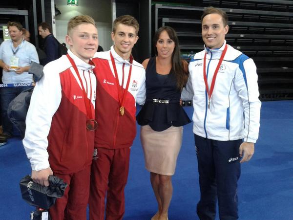 Gold medallist Max Whitlock with the second and third placed Daniel Keatings and Nile Wilson alongisde Beth Tweddle after the men's individual all-around event ©Twitter