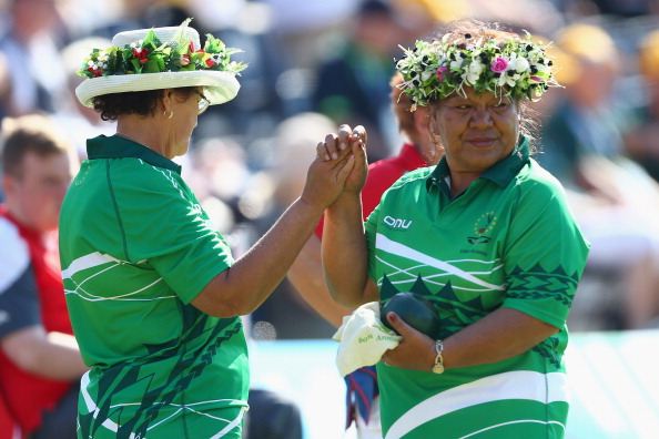 Linda Vavia and team mate Matangaro Tupuna of Cook Islands high-fiving on their way to a 12-7 lawn bowls victory over Jersey in the women's fours ©Getty Images
