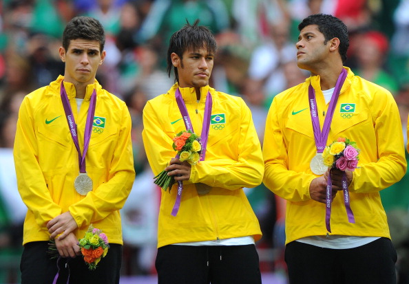 Neymar, pictured in between team mates Oscar and Hulk, won a silver medal for Brazil at London 2012 ©Getty Images