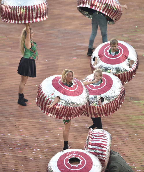 Participants at the Opening Ceremony wear costumes in the shape of Tunnock's Teacakes ©Getty Images
