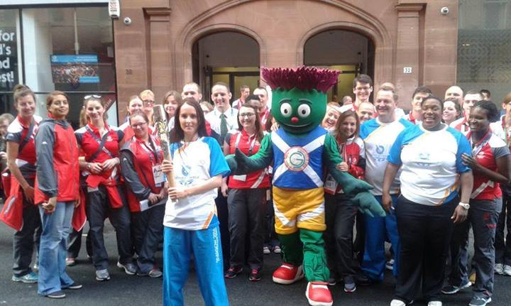 Glasgow 2014 mascot Clyde poses with Games workers and Baton bearers today ©Glasgow 2014