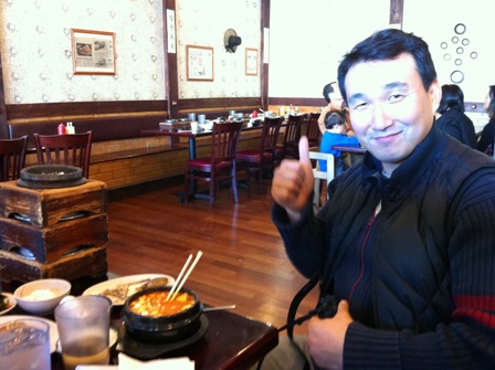 Kwang-Bae Kang, four-time Olympian, relaxing in a Korean restaurant in Atlanta ©Terrence Burns