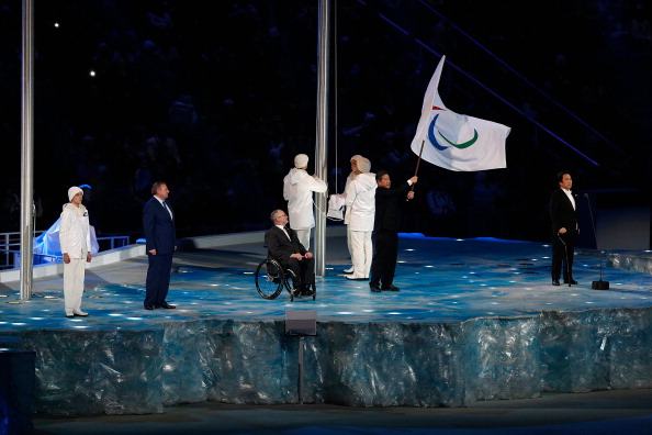 Sir Philip oversees the handing over of the Paralympic Flag to the Mayor of Pyeongchang during the Closing Ceremony of Sochi 2014 ©Getty Images
