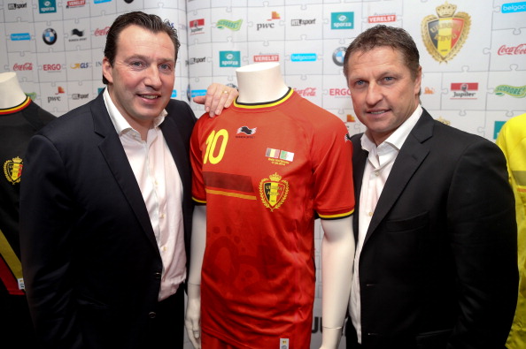 The Belgian kit, seen here with team coach Marc Wilmots (left) and assistant coach Vital Borkelmans, bears an unfamiliar logo ©AFP/Getty Images