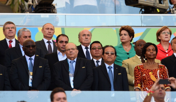 Vladimir Putin attended the World Cup alongside Brazilian and German leaders Dilma Rousseff and Angela Merkel, as well as FIFA boss Sepp Blatter and IOC President Thomas Bach ©Getty Images