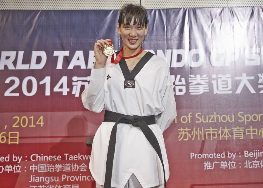 Zheng Shuyin doubled China's gold medal count in the women's over 67kg category as the hosts got off to a strong start in Suzhou ©WTF